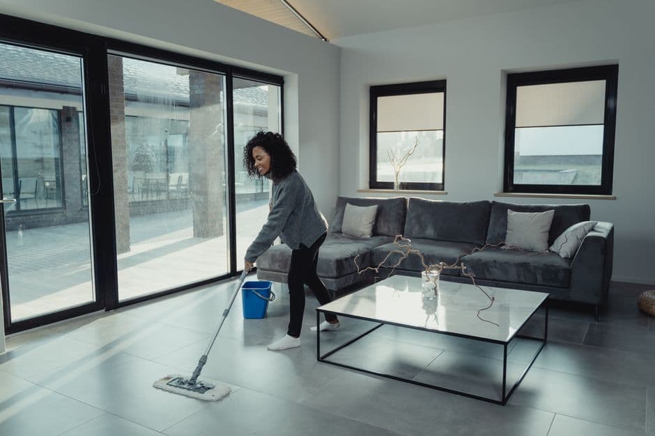 One of our cleaners working in a customer's living room